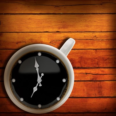 cup of coffee with a clock on it